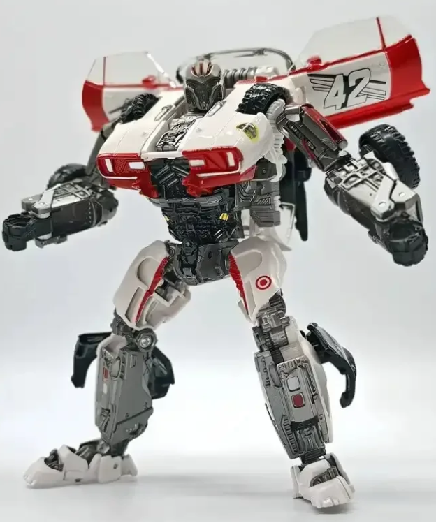 Transformers Studio Series Shatter action figure in robot mode with dual blaster accessories on table