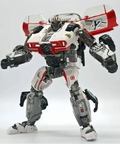 Transformers Studio Series Shatter action figure in robot mode with dual blaster accessories on table